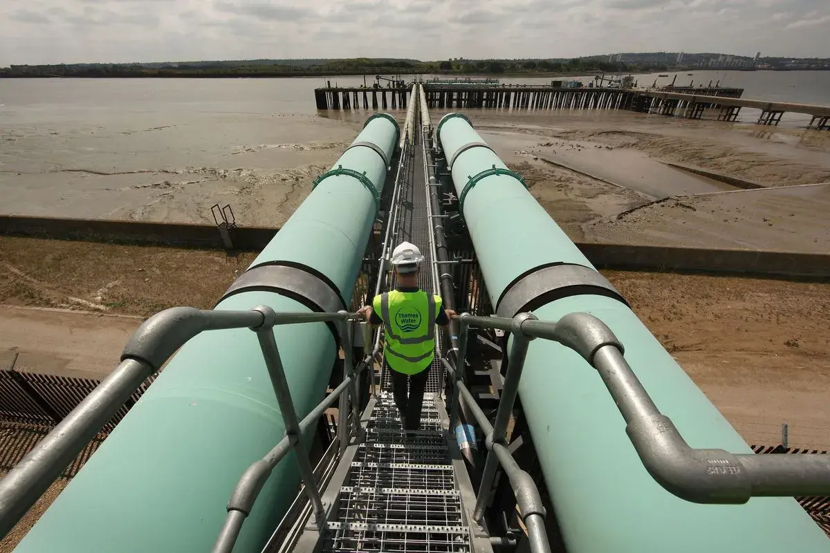 Field engineer on water transfer pipework