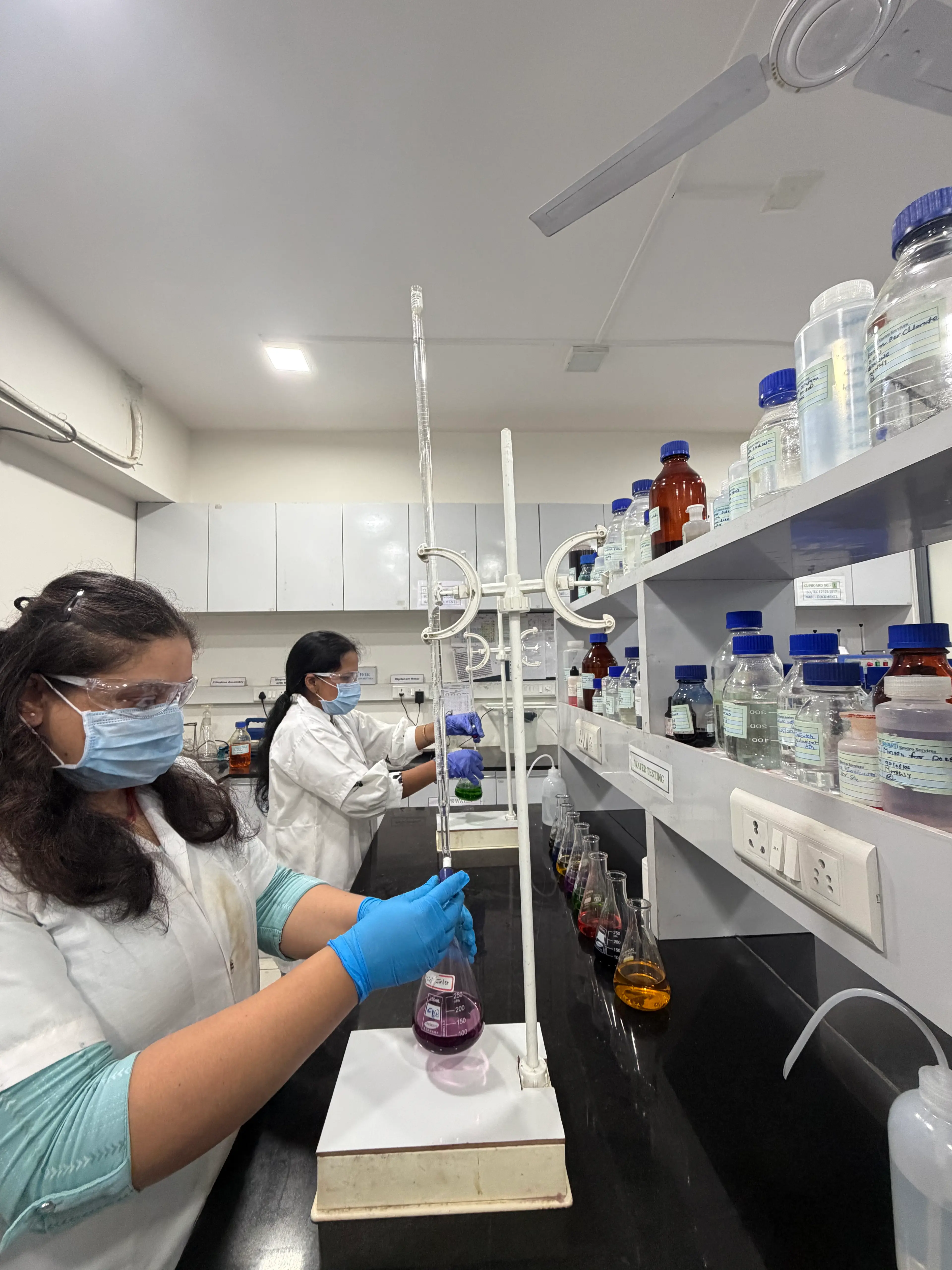 Laboratory technicians conducting water testing
